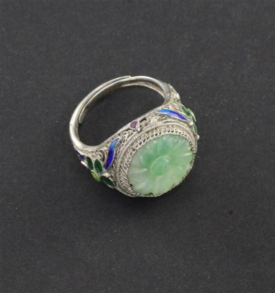 A Chinese jadeite silver and enamel ring, early 20th century, jadeite stone 12mm diam.